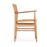 Armchair of oak with armrests of teak by 
																			Torben Strangaard