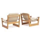 A pair of pine easy chairs by 
																			 Swedese Mobler