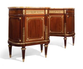 A Pair Of French Ormolu-Mounted Mahogany Side Cabinets by 
																	Charles Jeanselme