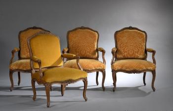 Suite de quatre larges fauteuils à dossier plat by 
																			Jean Avisse