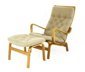 A Beechwood Chair And Ottoman by 
																	 Swedese Mobler