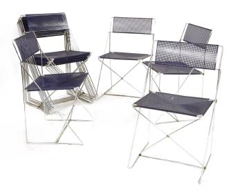 A Set Of Ten Chrome And Perforated X Line Stacking Chairs by 
																	Niels J Haugesen