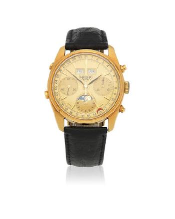 An 18K Gold Manual Wind Triple Calendar Chronograph Wristwatch With Moon Phase by 
																	 TAG Heuer