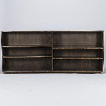 A bookshelf by 
																			Gunnel Nyman