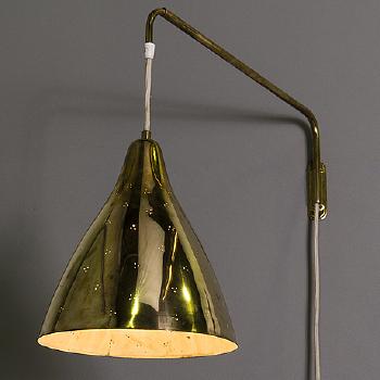 A mid 20th century wall light for Stockmann Orno, Finland by 
																			 Stockmann Orno