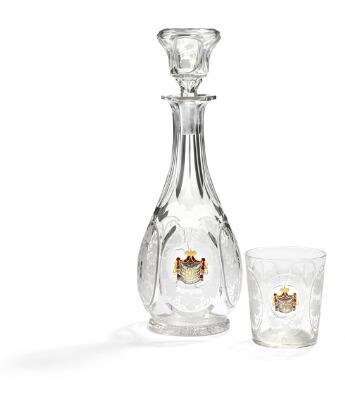 A Russian cut crystal baluster-shaped decanter with stopper and a matching glass by 
																			 Imperial Glass Factory