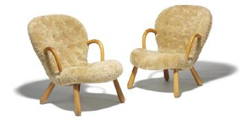 Clam, A  pair of easy chairs with round armrests and legs of beech by 
																			Philip Arctander
