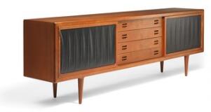 A long teak sideboard with round tapering legs by 
																			Mogens Kold