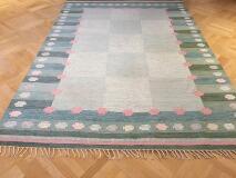 Bolmsö, Handwoven rölakan carpet of wool with pattern in shades of green with rose details by 
																			Anna-Johanna Angstrom