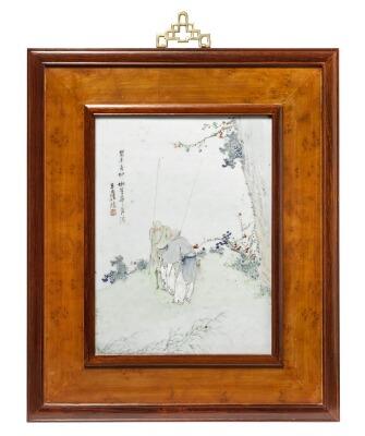 A Chinese porcelain plaque decorated in colours with two fishermen standing by a tree and flowers by 
																			 Wang Shaowei
