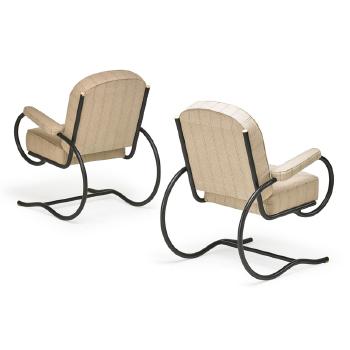 Pair of lounge chairs by 
																			Baptistin Spade