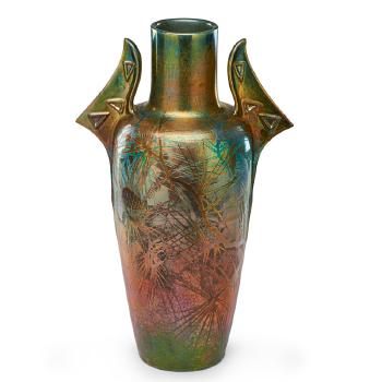 Tall two-handled vase with pine boughs by 
																			Clement Massier