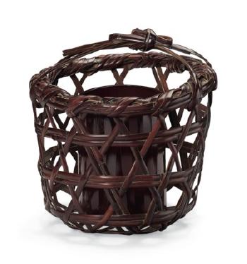 A bamboo basket by 
																	Rokansai Iizuka