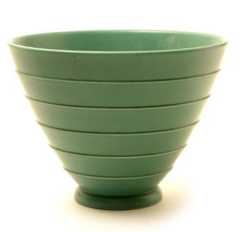 A matt green bowl, of tapering ribbed circular form by 
																			Keith Murray