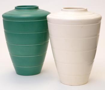 (1) A Wedgwood tapering conical vase, with matt green glaze, (2) Vase in cream glaze vase. by 
																			Keith Murray