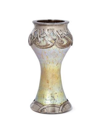 An iridescent glass vase with silver mounts by 
																	 Loetz