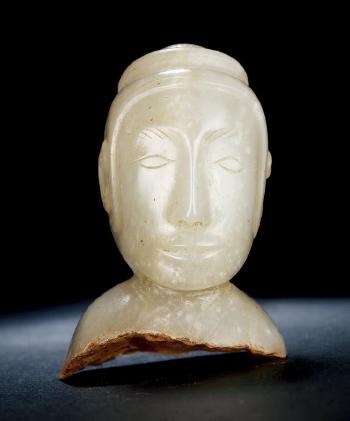 A White Jade Figure of a Man by 
																	 Han Dynasty