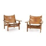 The Hunting Chair, A pair of solid oak easy chairs by 
																			 K P Mobler