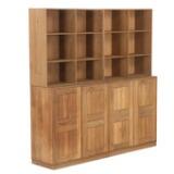 Wall unit of solid oak, consisting of two cabinets, two bookcases and two plinths by 
																			Mogens Koch