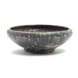 A glazed stoneware bowl by 
																			Patrick Nordstrom