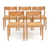 Five chairs with patinated oak frames by 
																			Poul M Volther