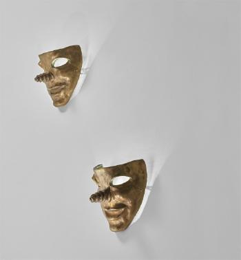 Pair of mask-form wall lights by 
																	Elisabeth Garouste