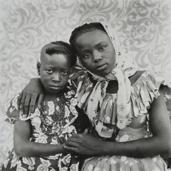 Untitled (two sisters with their arms around each other) by 
																	Seydou Keita