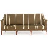 Three-seater sofa with eight tapering mahogany legs by 
																			Kaare Klint