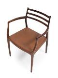 A rosewood armchair. by 
																			 J L Moller