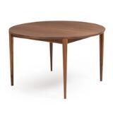 A round walnut extension table with three leaves by 
																			Henry Rosengren Hansen