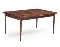 A rosewood dining table with extension, dark lacquered shoes by 
																			 J L Moller