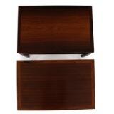 A pair of rosewood side tables with underlying shelf by 
																			 Andreas Tuck