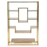 Brass etagere with smoke colored glass shelves by 
																			Romeo Rega
