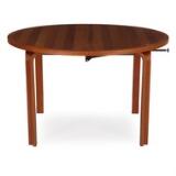 Circular dining table of mahogany with extension and three extra leaves by 
																			 Magnus Olesen
