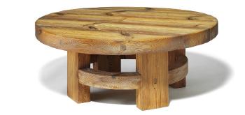 A rustic circular coffee table of solid Pomeranian pinewood by 
																	Jens Lyngsoe