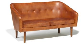 Freestanding two seater sofa with slightly tapering stained beech legs by 
																	Erik Worts
