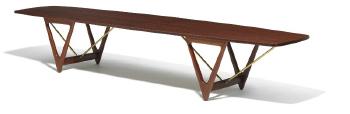 Long teak coffee table with convex shaped top by 
																	 Jason Mobler