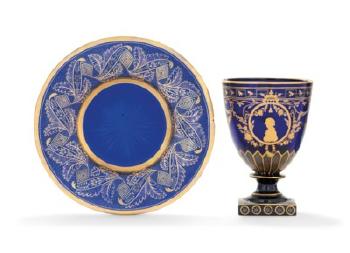 A Blue Glass Goblet and Saucer by 
																	 Imperial Glass Factory
