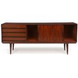 Sideboard of rosewood, front with two sliding doors and four drawers by 
																			Gunni Omann