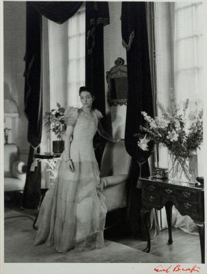 Portrait of An Elegant Lady Standing Full Length By A Window by 
																	Cecil Beaton