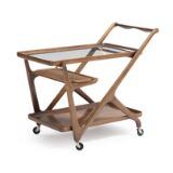 A walnut serving cart with removable tray and glass top by 
																			Cesare Lacca