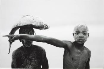 Two Boys with a Fish from Faith by 
																	Mario Macilau