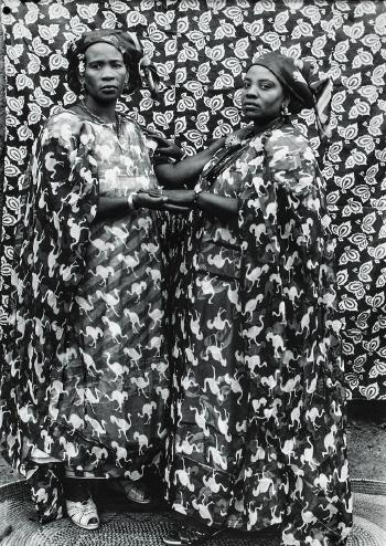 Bamako (two females holding hands) by 
																	Seydou Keita