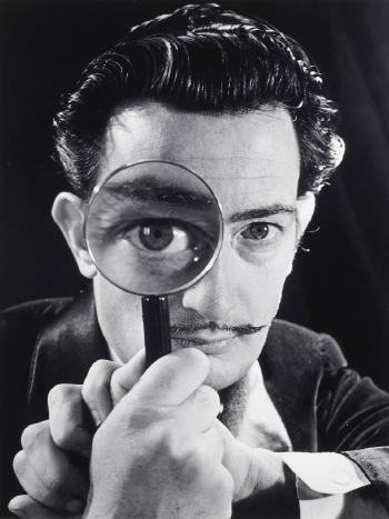 Salvador Dali with magnifying glass by 
																	Philippe Halsman
