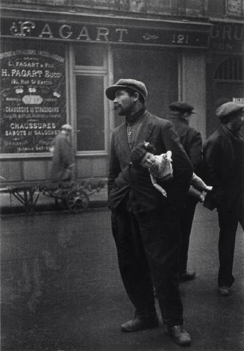 Man with Doll near Rue St. Denis, Old Section of Paris, 1930 by 
																	Alfred Eisenstaedt
