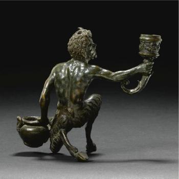 Kneeling satyr, arm outstretched holding a cornucopia terminating in aL14 candle nozzel by 
																			 Desiderio da Firenze