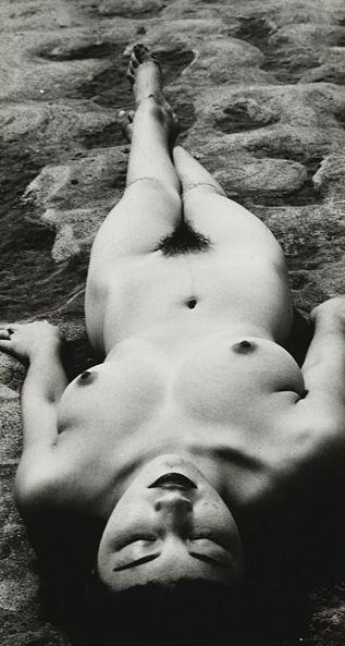 Nude lying on sand by 
																	Minayoshi Takada