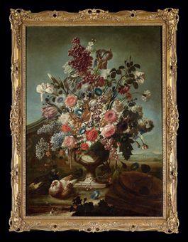 Tulips, roses, peonies, irises and other flower in an ornamental urn, with a pair of doves by 
																	Karel van Vogelaer