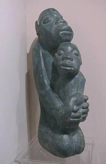 Mother and child by 
																	Joseph Ndandarika